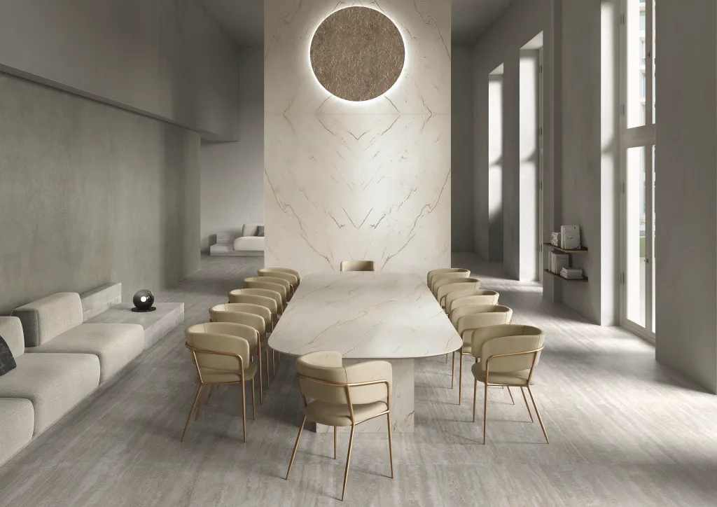 Meeting space with Infinity porcelain slab surfaces in warm neutral tones